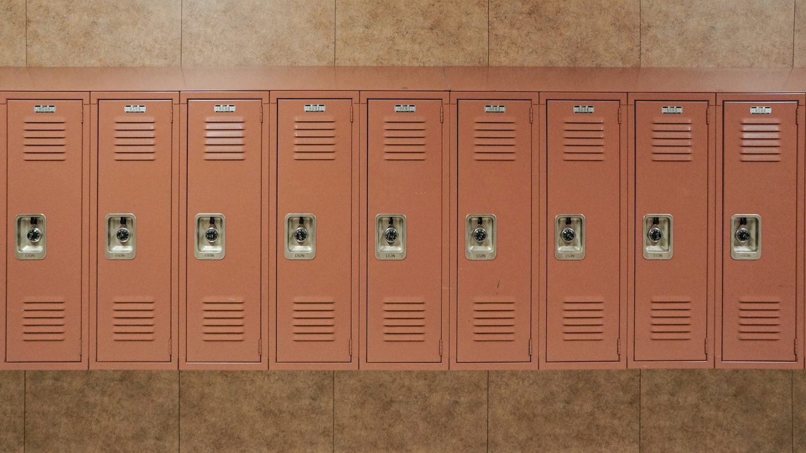 A row of school lockers in a corridor.